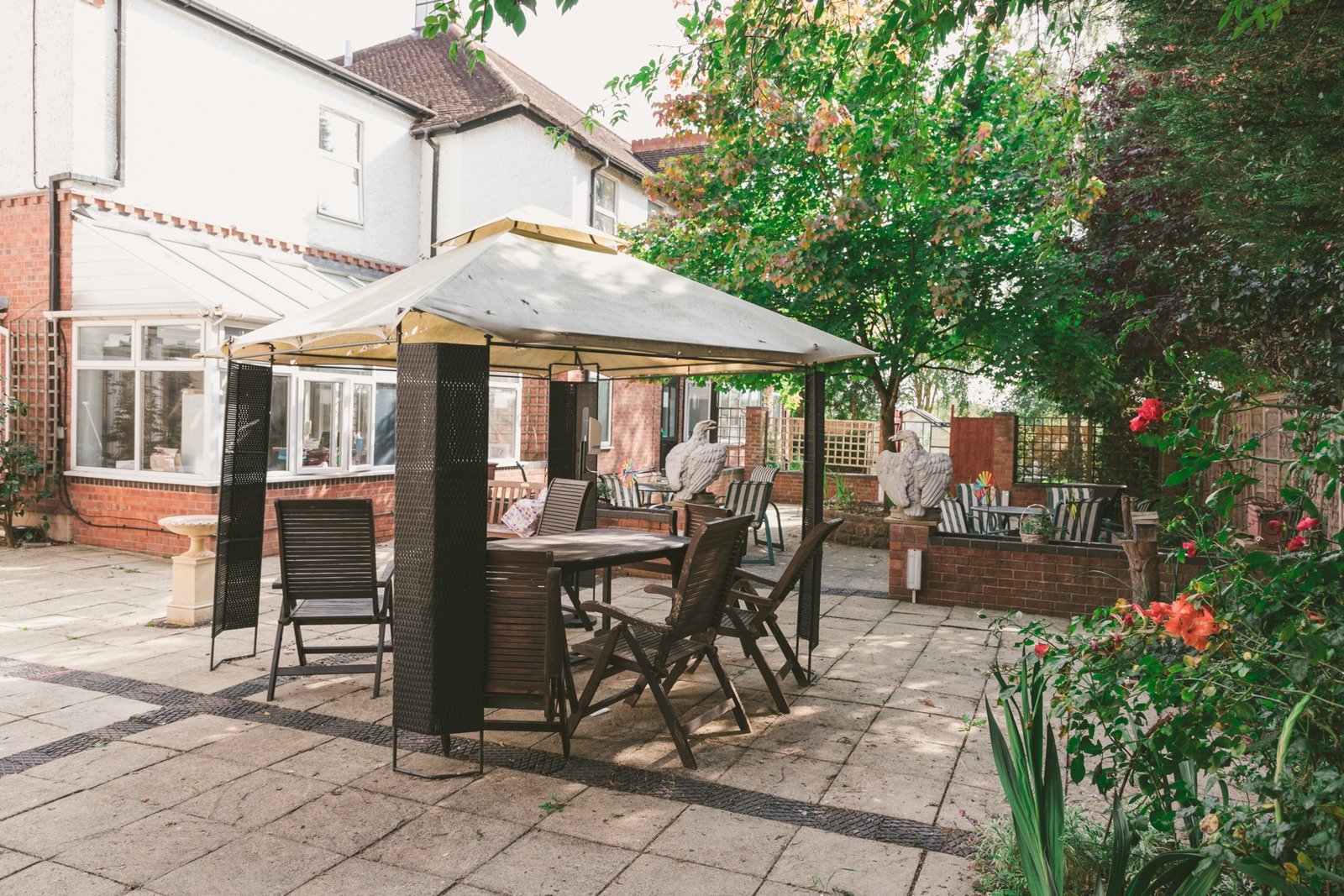 Garden gazebo with dining table set for residents